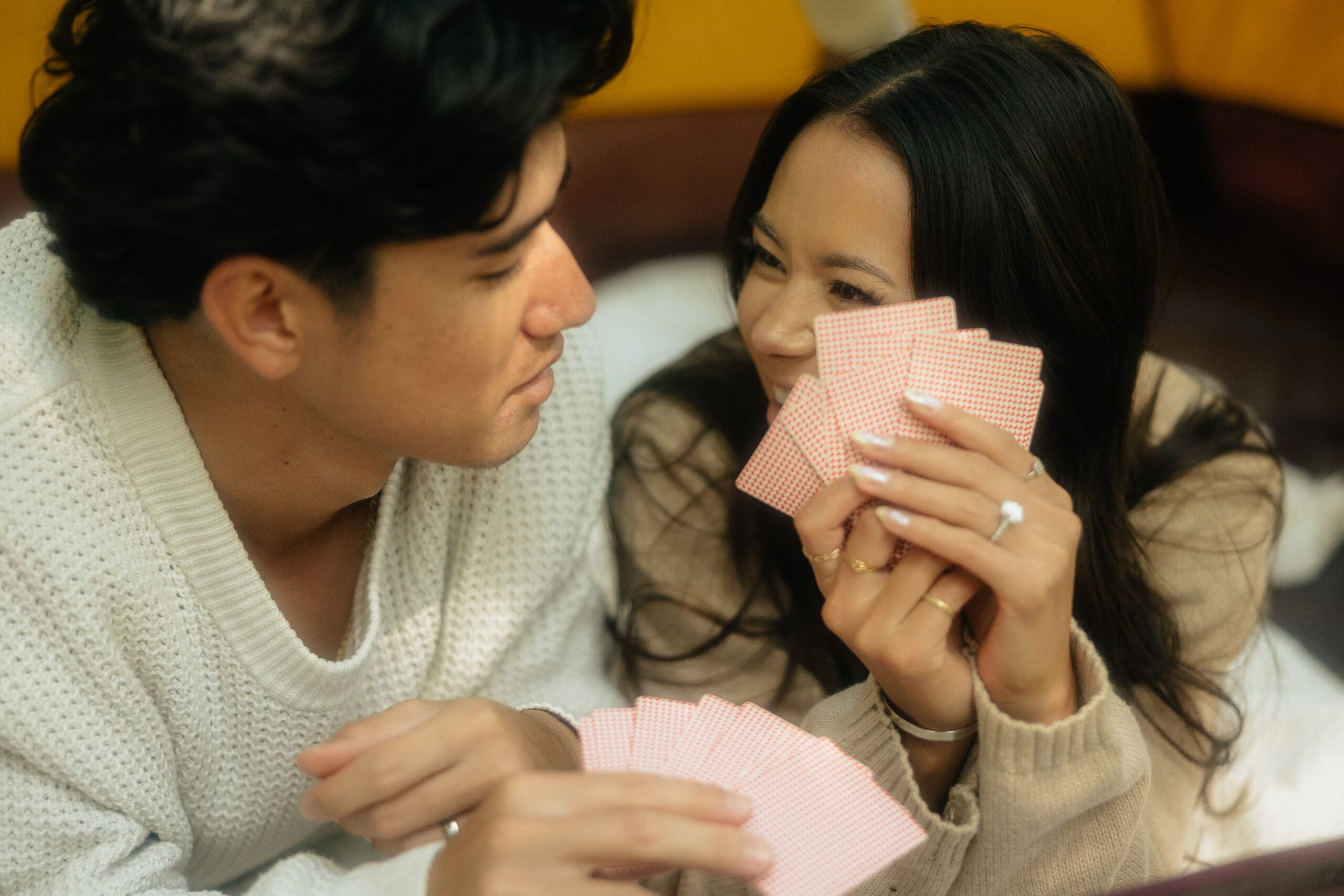 couple smiling while playing cards at their washington elopement