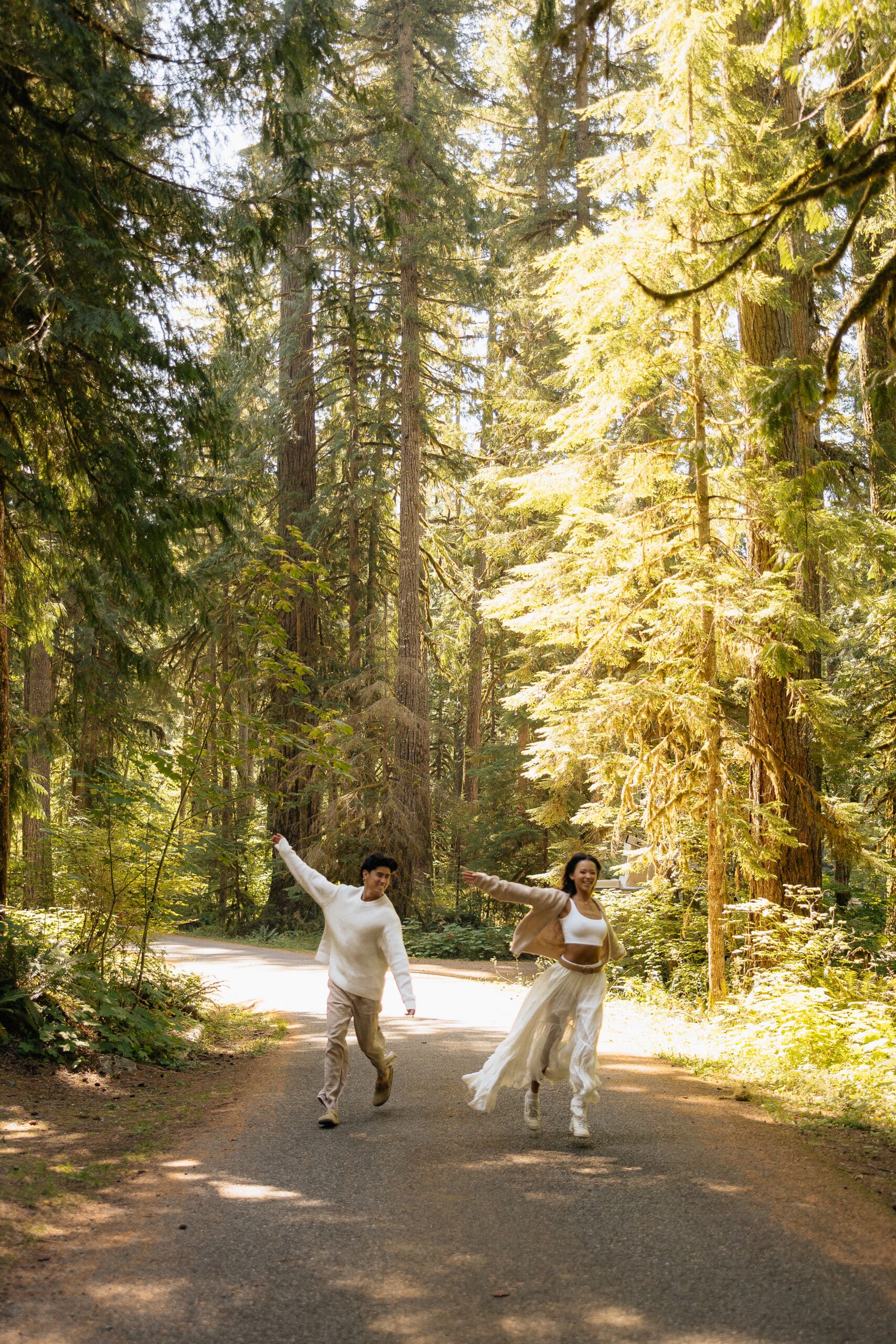 couple playing and running down the road together