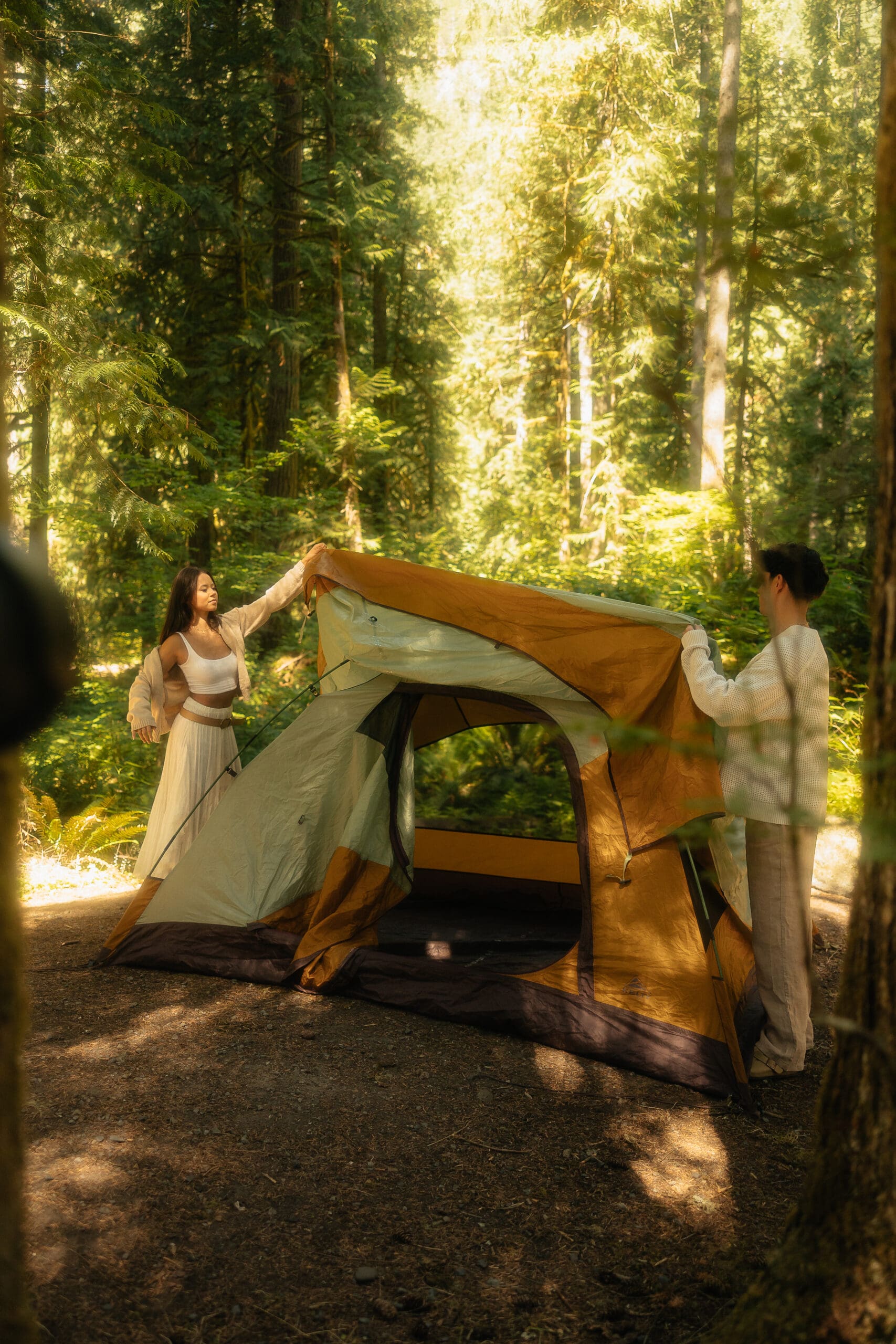 Couple setting up a tent for their elopement